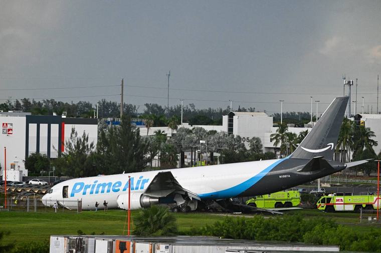 Amazon cargo plane overshoots Miami runway, hits vehicles, catches fire